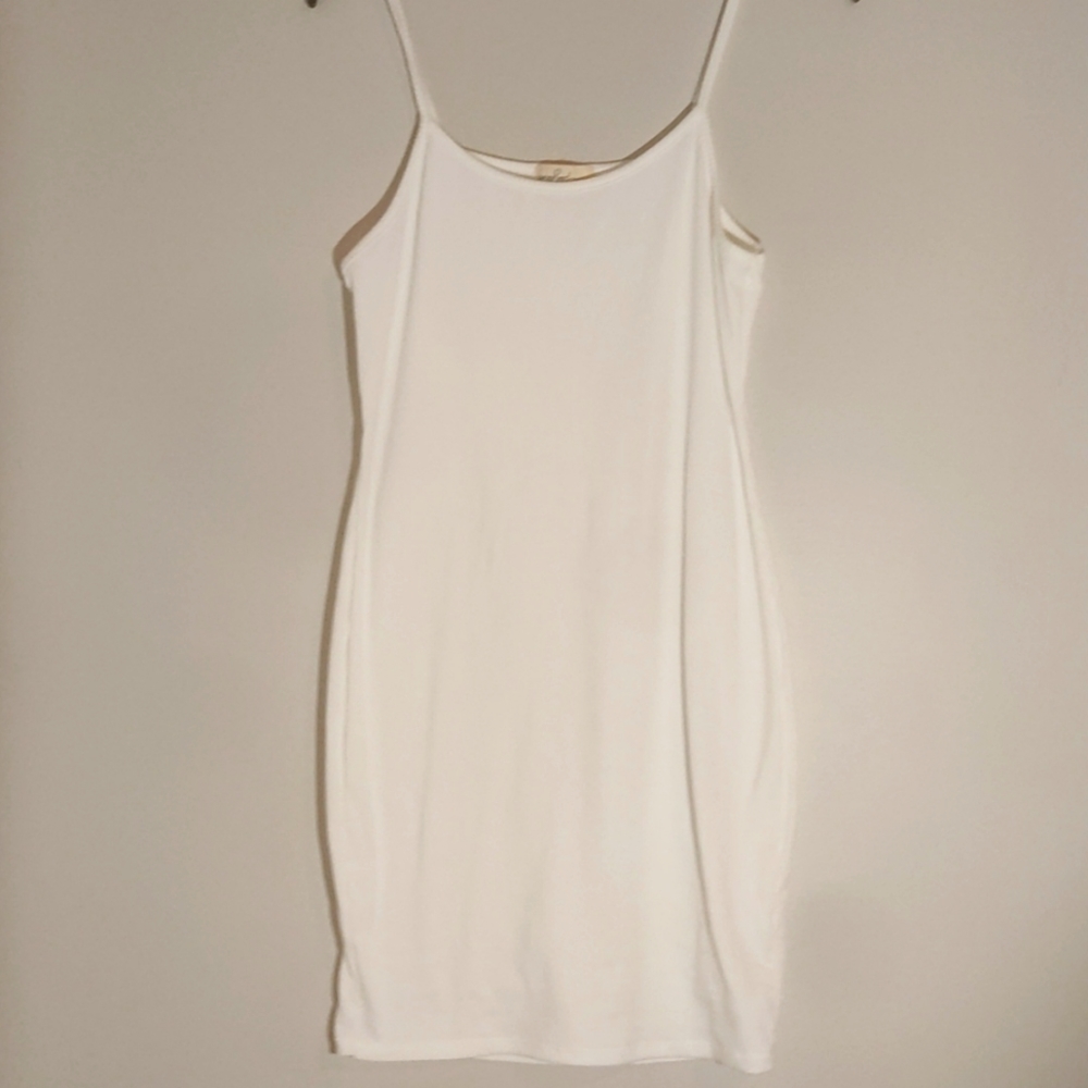 All white mid thigh dress.